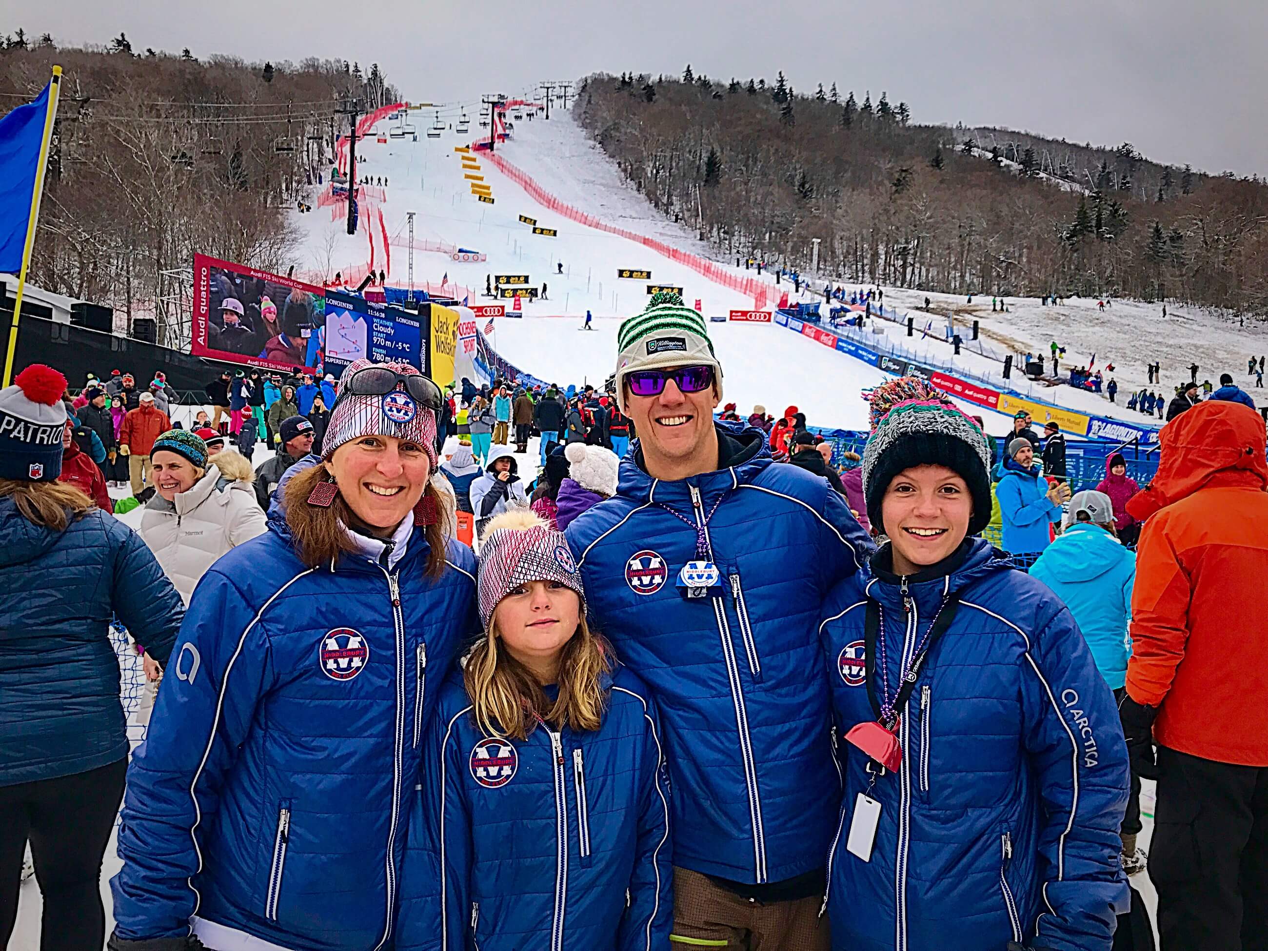 Ski racing dad from Middlebury, VT wearing their Arctica team jackets at a World Cup ski race.