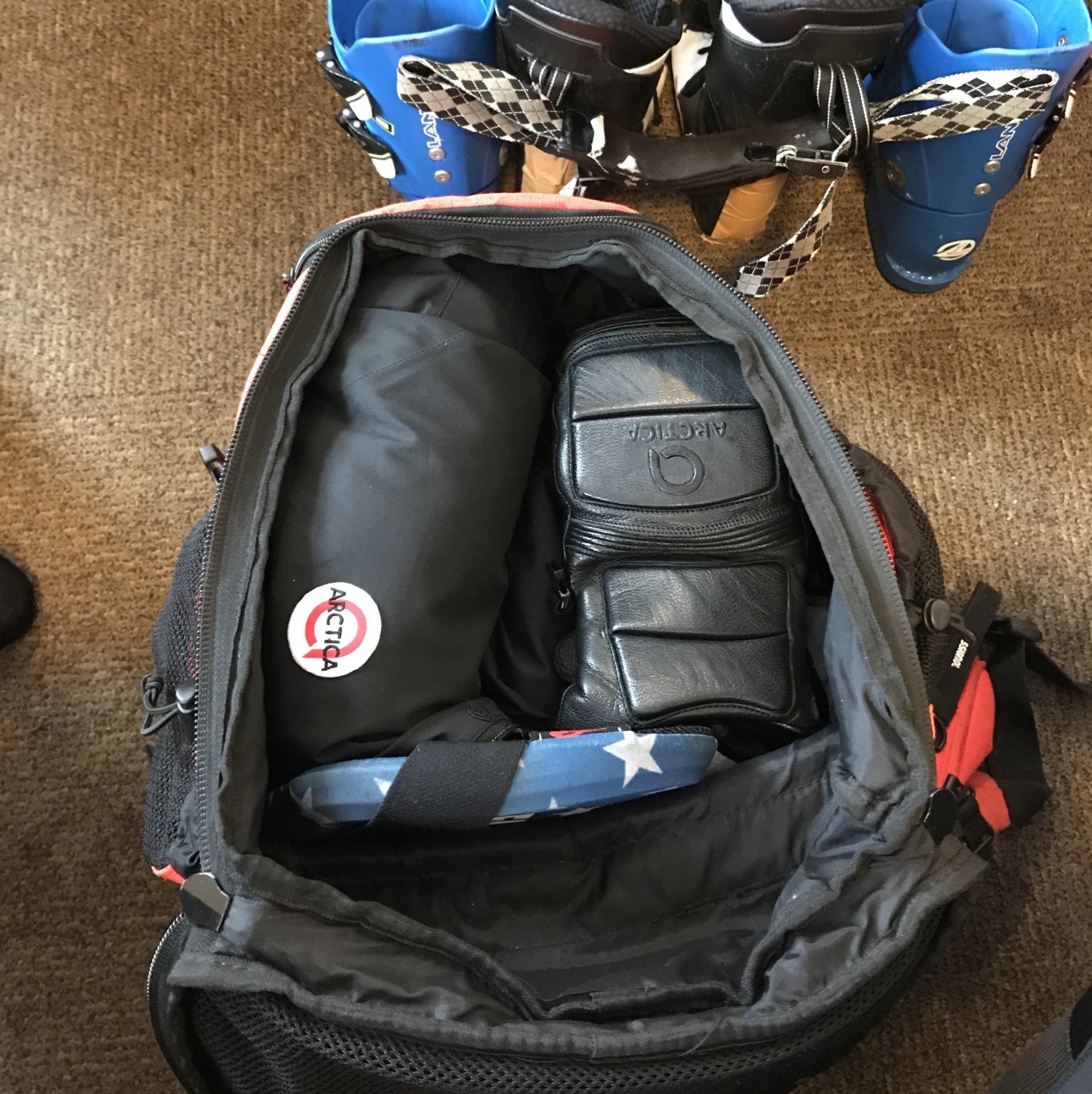 Ski racer's gear bag filled with Arctica gear.