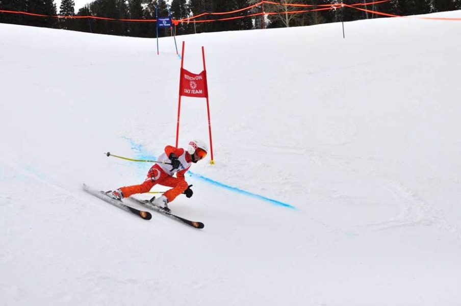 Young ski racer in an Arctica GS Speed suit on the ski racing hill at Brighton.