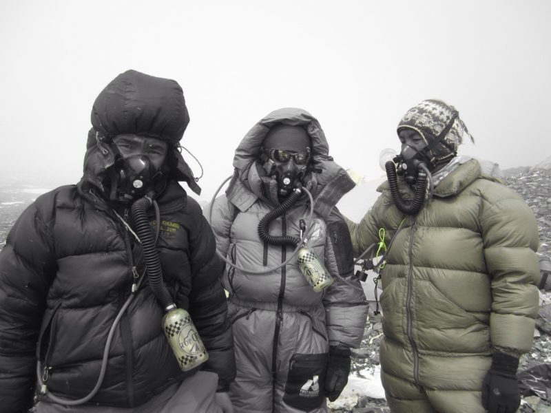 Sherpas on the summit of Mount Everest in their warm, yet lightweight 900 fill down jackets and suits. These jackets are expensive and would not make good down jackets for ski racers.