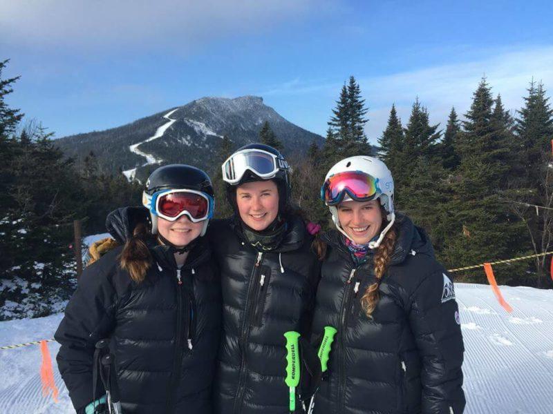 Okemo Mountain School athletes wearing their warm Arctica Pinnacle Down ski team jackets.
